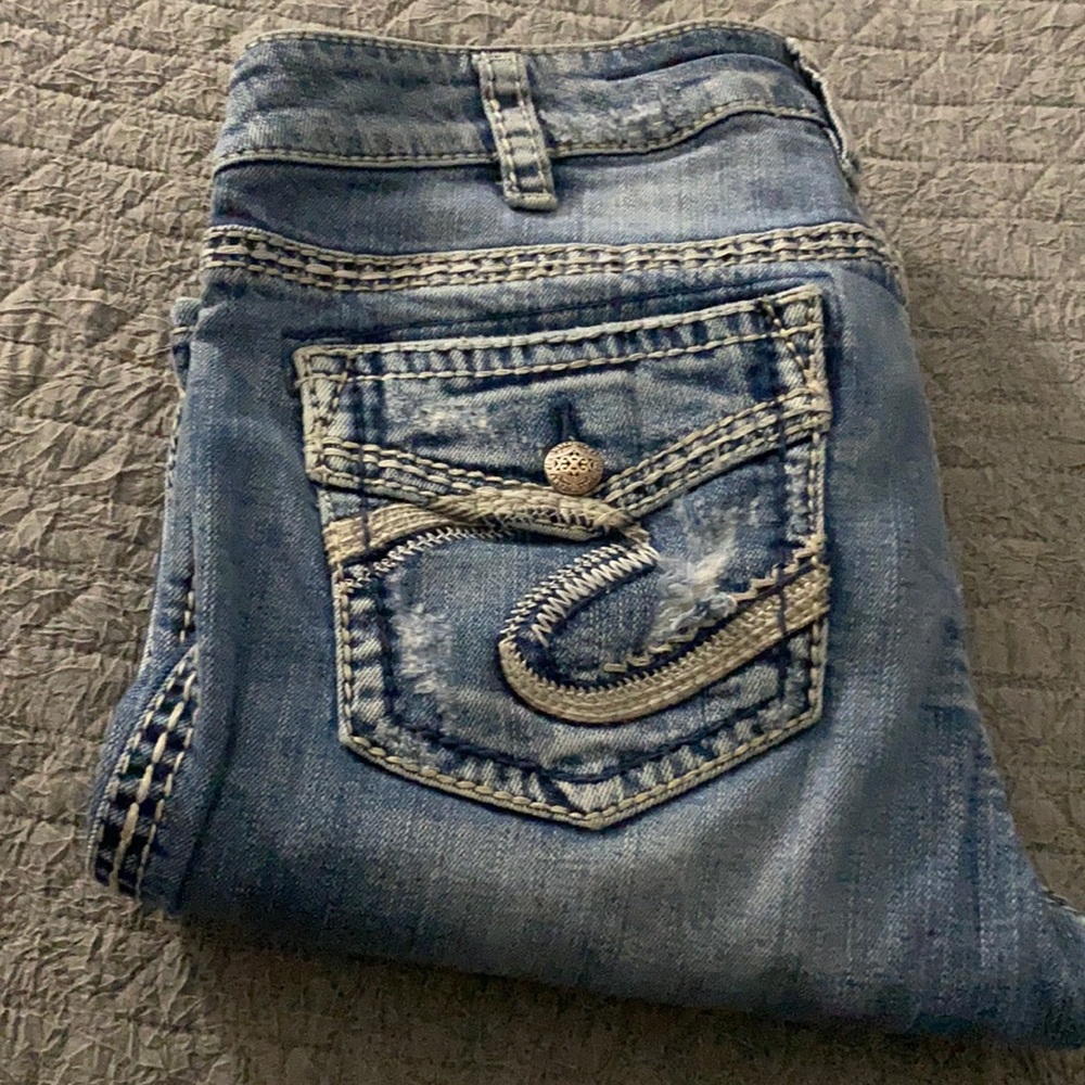 Silver brand Aiko flap bootcut destroyed jeans